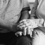 seniors holding hands